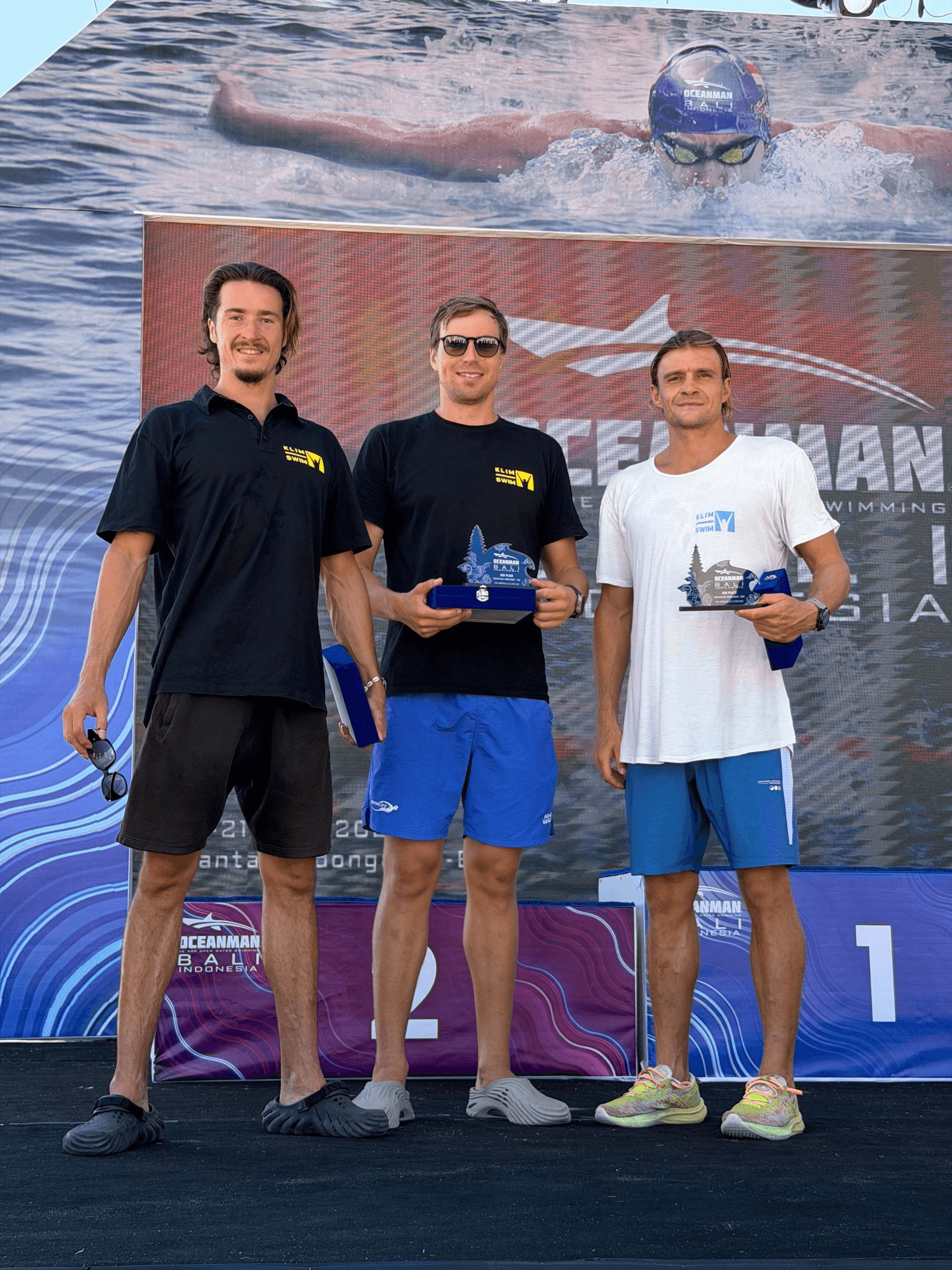 Participants with trophies at the Bali open-water camp and Oceanman race, 2026